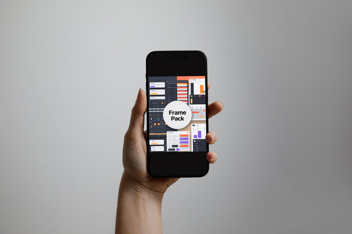 A hand holds a black smartphone against a plain light gray background. The phone screen displays a collage of dashboard interface panels with a white circular badge reading 'Frame Pack'.