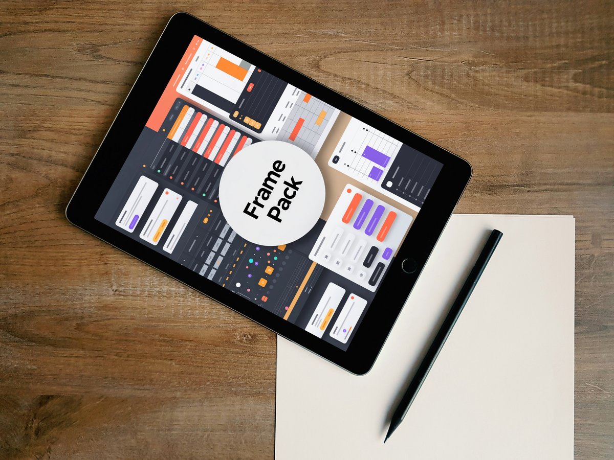 A black tablet lying diagonally on a wooden desk, displaying a UI design template pack with a large white circle overlay reading 'Frame pack.' A beige sheet of paper and a black stylus are placed beside it.