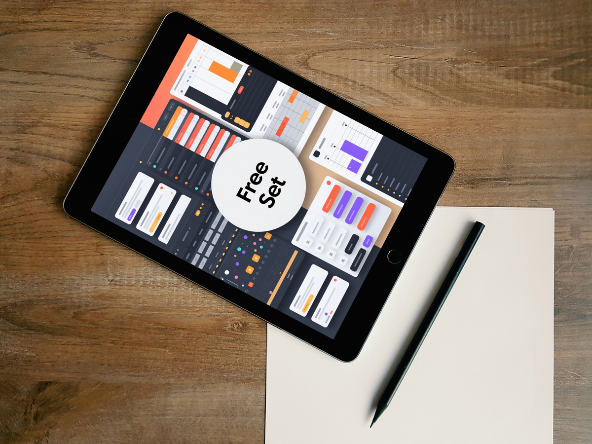A black tablet lying diagonally on a wooden desk, displaying a dashboard interface with a large white circle overlay reading 'Free Set'. A beige sheet of paper and a black stylus are placed beneath the tablet.